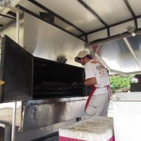Will Roberson and Grill-Zilla in action. Together they cooked 782.22 pounds of Boston butt and 200 racks of ribs! They only work for charity - Will says if he had to worry about making money it would take all the fun out of it!