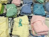 Tiny sweaters crocheted by Kay Riddick, Mickey Hoggard, and Annie Lou Gaskins