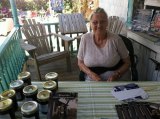 Della signed books and visited with customers on the porch of Books to Be Red during the Ocrafolk Festival last weekend. 