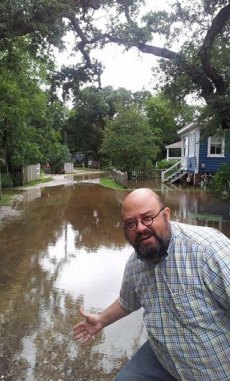 Local man complains about regularly occurring natural phenomena. (Howard Street rain puddles.)