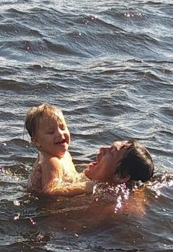 Gus Sanchez and his son Bryson enjoy Lake Gaston during the evacuation.
