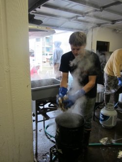 Waterman Erick O'Neal throws some more oysters in the steamer.