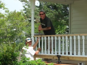 Jason and Roger put the finishing touches on the porch