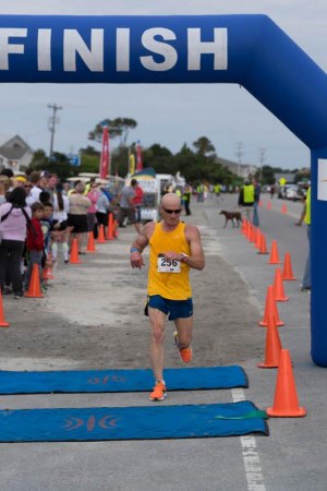 Keith checks his time as he wins the 10K