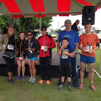 10K Winner's Circle: Chelsea, Marissa, Lulu, Keith, Chito (with his son, Uriel) and Stephen.