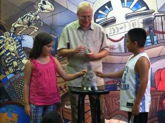Magic storyteller Mark Daniel brought his bunny to the library! Emilia and Uriel made it magically appear.