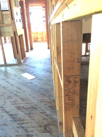 Hidden treasure! When we gutted our house, we found a stud where Amy's grandfather had signed his name: "Lawton Howard. Moved in June 22, 1957." Underneath, we had the Samaritan's Purse volunteers continue the story by signing their names.