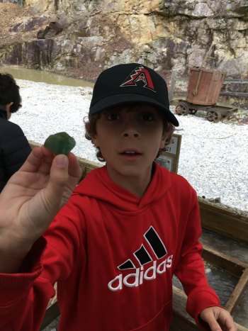 Finn found a green rock while mining for gems!