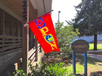 Look for the flag when the library is open!