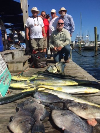 Brad Nicholson party with big mahi caught on spin rod. Does anybody recognize the old guy on the top right? 