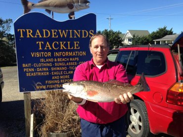 Ken DeBarth with dinner: 9 slot sized puppy drum caught on cut mullet.