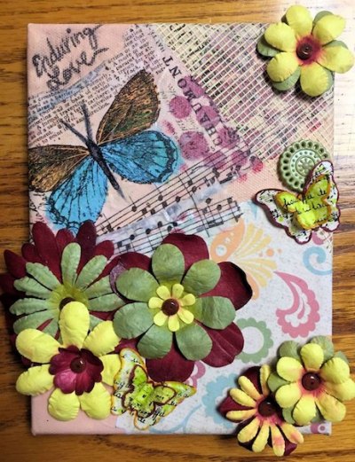 This one came home with us! Mariah is spending her plant-watering job money on this collage by Jan Nichols McClay.