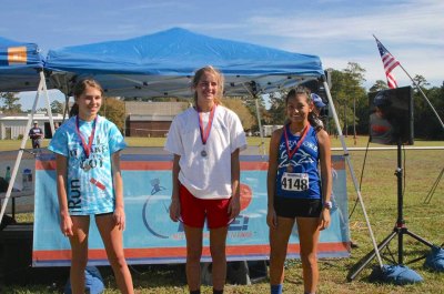 Overall winners of the girls' race: 1st, Kathleen Burroughs of Granville Central, 2nd, Hannah Niebel of Lejeune, 3rd, Karen Perez of Ocracoke.