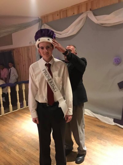 Senior Dylan Sutton gets his crown. This will be Mr. Padgett's last crowning ceremony – he retires from Ocracoke School next week.