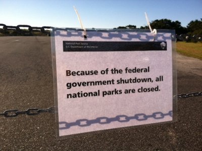 Sign at lifeguard beach parking lot.