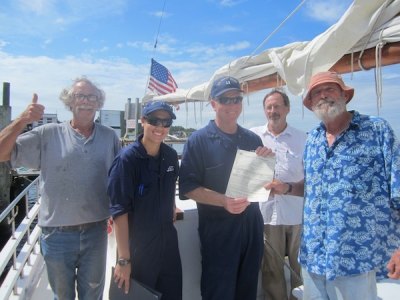 The Wilma Lee passed inspection! Tom Pahl, Ensign Michelle Rosenburg, Lt. Billy Taylor, Ken DeBarth, and Capt. Rob Temple pose with the brand new certificate.