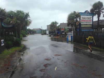 9am-ish on Saturday; the tide got a bit higher and covered the road. Cute boots, Mariah!