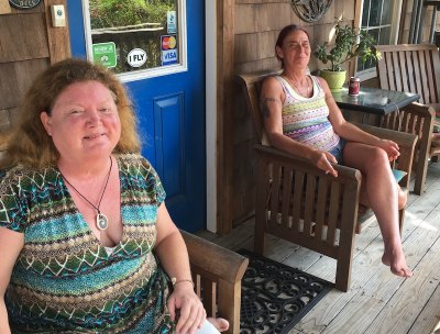 Pam Degen and Traci Ball relax on the porch of Pam’s Pelican B&B.