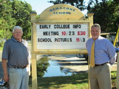 Jeff Schleicher and Walt Padgett pose with the new sign….