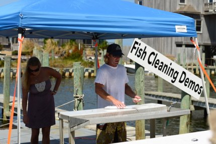 Local fishermen conduct fish cleaning demos throughout the day to show anglers, young and old, how to fillet a fish the right way.