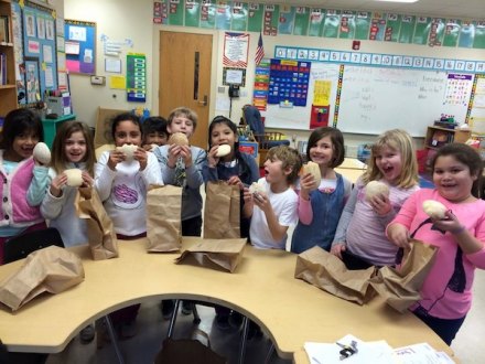First graders show off their homemade bread! Yum! 