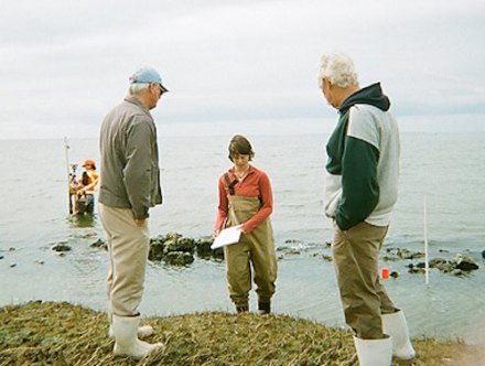 Gene Ballance, Erin Fleckenstein of NCCF, and James Barrie Gaskill on the shoreline at Springer's Point