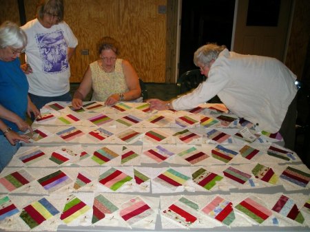 Ocracoke quilters working on a cracker quilt.