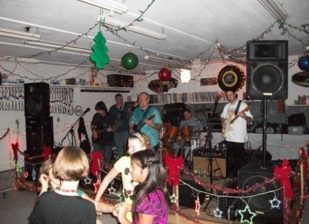 Ocracoke Rockers! Lou, Clifton, Martin, Tommy, and Aaron. I think the dancers are Mattie, Caroline, Kaylee, and Bricia. c. 2009