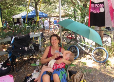 Jen Ray relaxes in the shade with her baby, Zoey