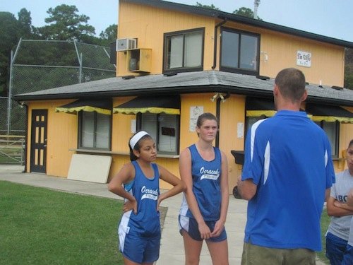 Last minute instructions, with Karen, Kaylee, and Coach B. Of course, Karen just runs flat out as hard as she can. I don't think you can instruct that. Karen is a freshman, other teams in the conference should be scaared.