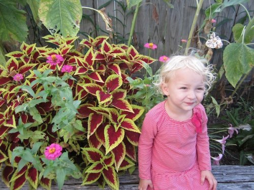 Essie next to her favorite flowers of the moment.