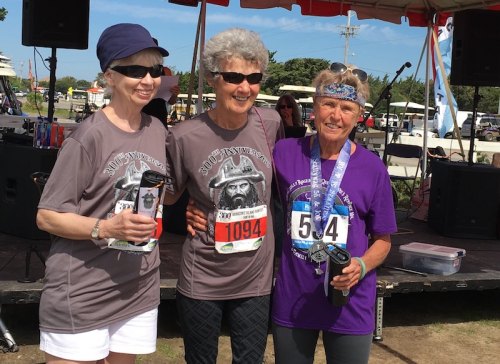 The 5K female winners in the 70-99 category; L-R; Ocracoke’s own Cindy Hichens, Jen Esham, and Vera Buxton