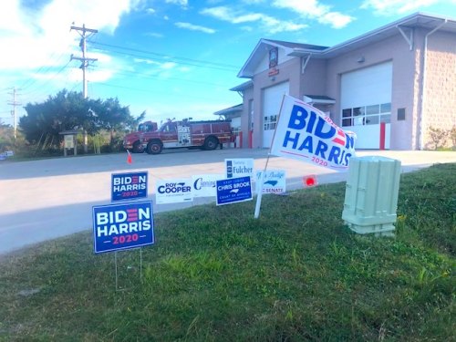 Battle of the Signs Part 1: On Thursday, Mickey Baker, who carries the torch for Ocracoke Dems, placed candidate signs a careful 50 feet from the polling place entrance. 