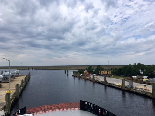 The beautiful view of marsh and clouds from the top deck of the M/V Southport, which was in the water and almost ready for sail away.